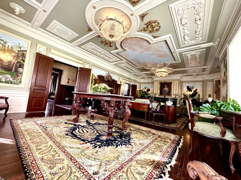 The grand Drawing Room with hand-painted murals and ornate woodwork at 300 Clifton