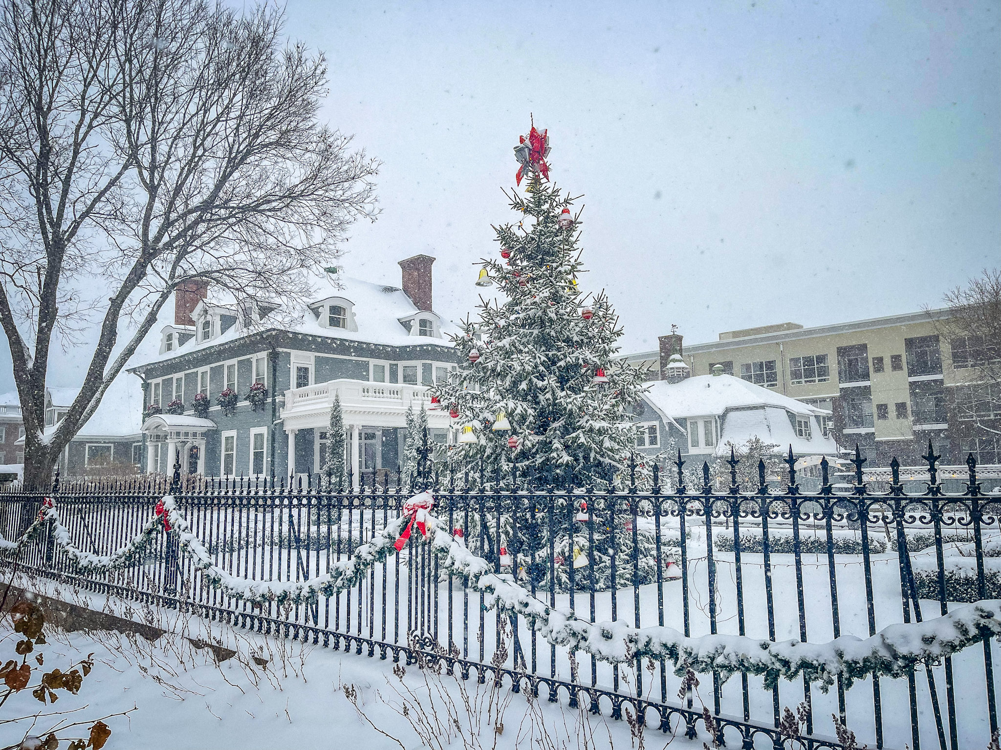 300 Clifton mansion decorated for Christmas, with garlands and warm holiday lights glowing in the historic Carpenter Mansion