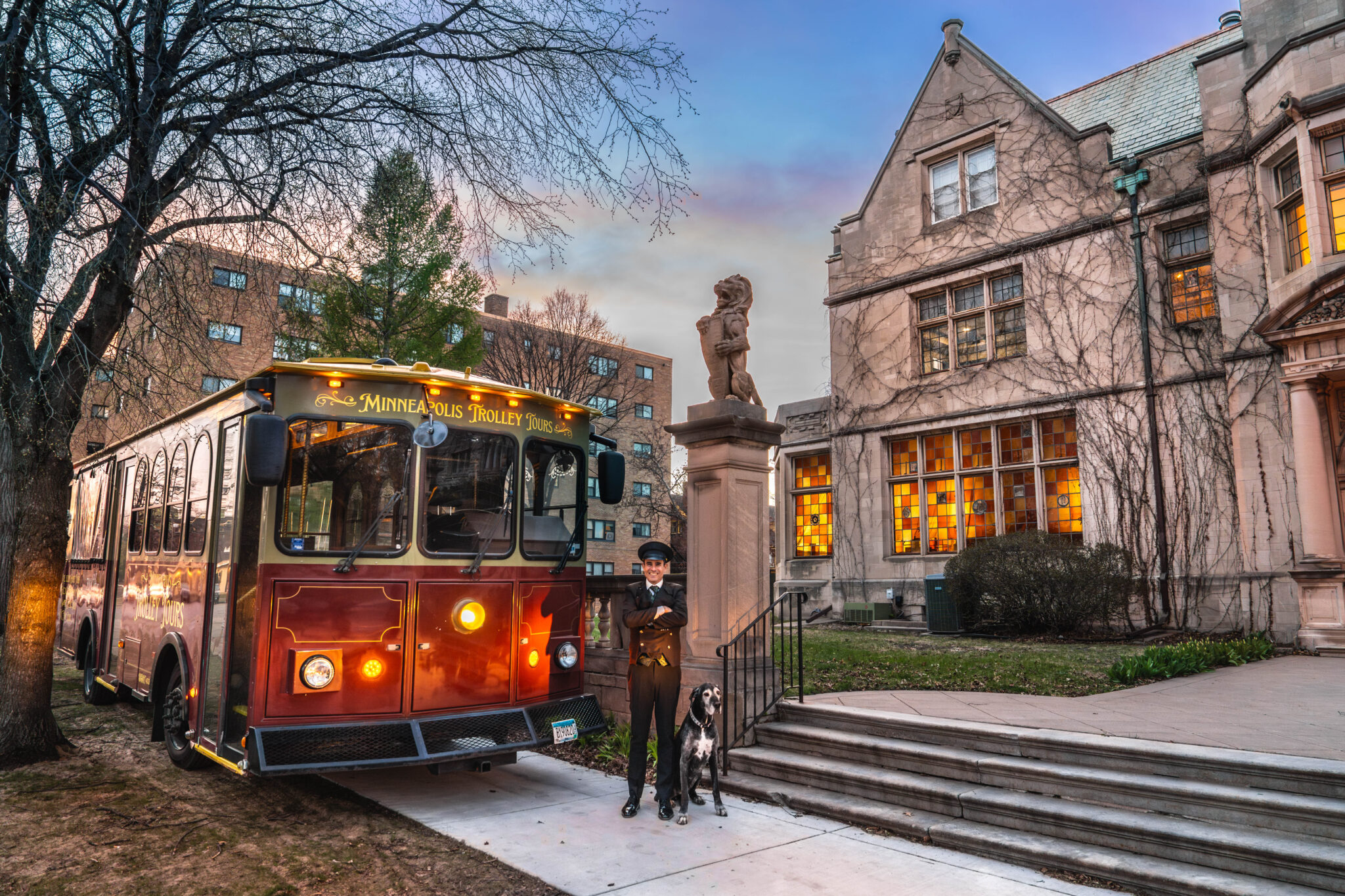 Minneapolis Trolley Tours trolley parked outside the historic Pillsbury Club mansion in Minneapolis